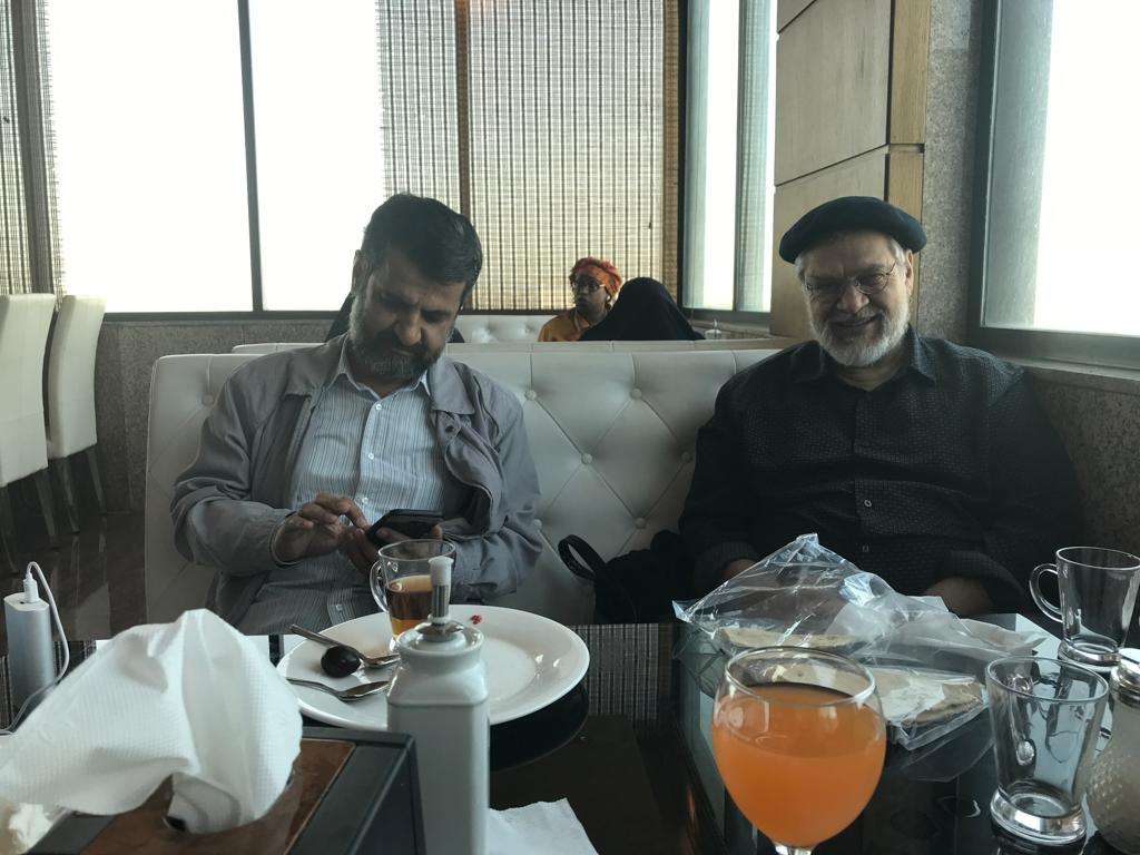 On the Right: Nader Talebzadeh